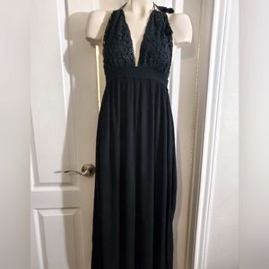 Black maxi dress with black embroidery on top and ties around the neck